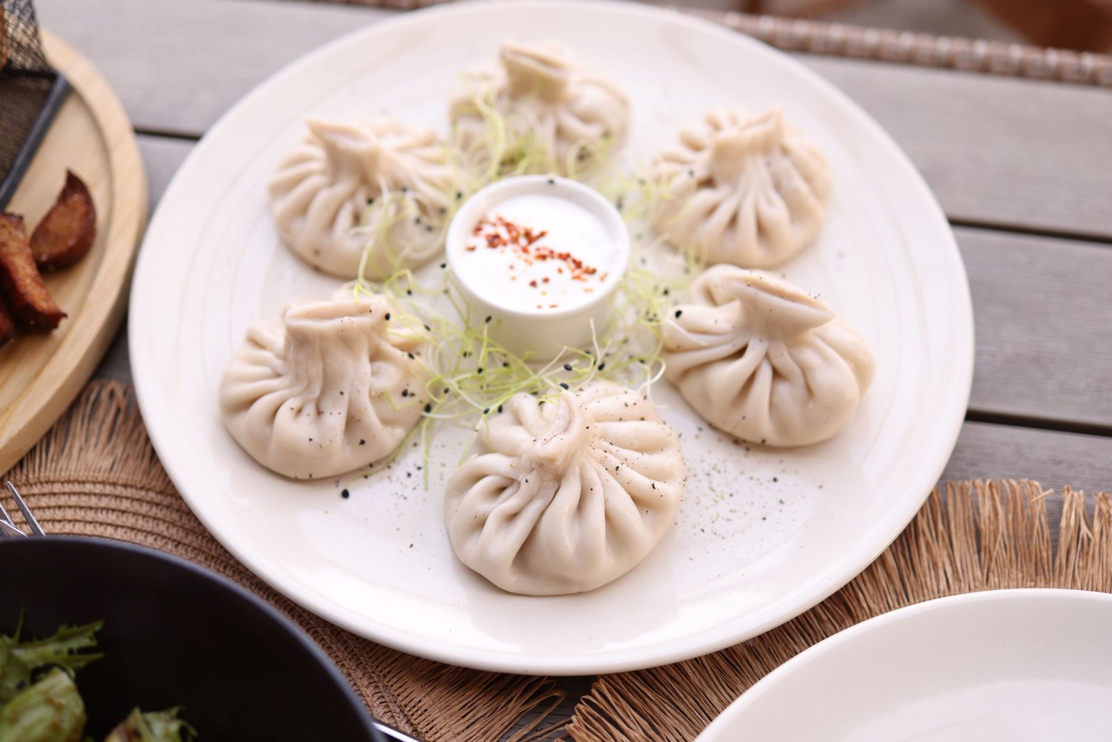 Close-up of dumplings served with sauce, perfect for a restaurant meal concept.